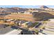 Panoramic aerial view of a residential community with mountain views and well-manicured landscaping at 52 Reverie Heights Ave, Henderson, NV 89011