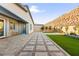 Wide view of the backyard showing an outdoor seating area and a grass area at 52 Reverie Heights Ave, Henderson, NV 89011