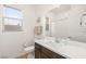 Bathroom features a modern vanity, a sink, and a shower behind a white shower curtain at 52 Reverie Heights Ave, Henderson, NV 89011