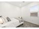 Cozy bedroom with a comfortable bed, accent chair, and soft, neutral decor at 52 Reverie Heights Ave, Henderson, NV 89011