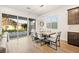 Dining area with natural light and sliding glass doors leading to the backyard at 52 Reverie Heights Ave, Henderson, NV 89011