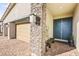 Modern home featuring a brick driveway, stone facade accents, and a steel double door at 52 Reverie Heights Ave, Henderson, NV 89011