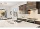 Modern kitchen with quartz countertops, stainless steel appliances, and stylish backsplash at 52 Reverie Heights Ave, Henderson, NV 89011