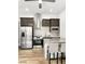 Modern kitchen features stainless steel appliances, a breakfast bar, and sleek cabinetry at 52 Reverie Heights Ave, Henderson, NV 89011