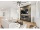Modern living room boasts a sleek fireplace, mounted TV, and comfortable seating area at 52 Reverie Heights Ave, Henderson, NV 89011