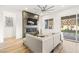 An open-concept living room featuring a fireplace, tile surround, contemporary furnishings, and backyard access at 52 Reverie Heights Ave, Henderson, NV 89011