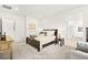 Serene bedroom retreat with neutral tones, plush carpet, and ensuite bathroom access at 52 Reverie Heights Ave, Henderson, NV 89011