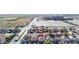 Aerial view of a residential community close to a stadium, with a home pinpointed in red at 5573 La Perla Ct, Las Vegas, NV 89122