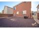 Large backyard with privacy fence and low-maintenance gravel at 5573 La Perla Ct, Las Vegas, NV 89122