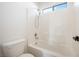 Bright bathroom with shower and white-tiled walls at 5573 La Perla Ct, Las Vegas, NV 89122