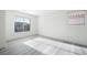 The naturally lit bedroom features horizontal blinds and modern flooring at 5573 La Perla Ct, Las Vegas, NV 89122