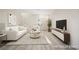 Inviting, virtually staged living room features an entertainment center, comfortable seating, and stylish decor at 5573 La Perla Ct, Las Vegas, NV 89122