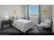Bright secondary bedroom with a charming design, featuring a comfortable bed and cheerful decor at 5777 Crenellated St # Lot 56, Las Vegas, NV 89148