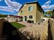 This backyard features a pergola, small grass area, and desert landscaping at 5941 Galway Bay St, North Las Vegas, NV 89081
