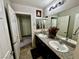 Bathroom featuring a double sink vanity with granite countertops and stylish lighting at 5941 Galway Bay St, North Las Vegas, NV 89081