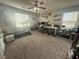 Bedroom with a treadmill and windows offering bright, natural light at 5941 Galway Bay St, North Las Vegas, NV 89081