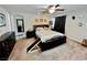 Comfortable bedroom featuring carpet, ceiling fan and decor at 5941 Galway Bay St, North Las Vegas, NV 89081