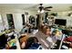 Cluttered spare bedroom with carpet, ceiling fan and a closet at 5941 Galway Bay St, North Las Vegas, NV 89081