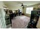 Spacious bedroom with a ceiling fan, lots of sunlight and neutral carpeting at 5941 Galway Bay St, North Las Vegas, NV 89081