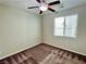 This bedroom has natural light from a window and is enhanced with a ceiling fan at 5941 Galway Bay St, North Las Vegas, NV 89081