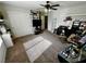 A well-lit bedroom features a ceiling fan, double-door closet, and carpeted flooring at 5941 Galway Bay St, North Las Vegas, NV 89081