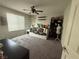 Neutral bedroom with window, fan and a white daybed at 5941 Galway Bay St, North Las Vegas, NV 89081