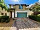 Two-story home featuring a two-car garage, tile roof, and beautiful desert landscaping in a well-maintained community at 5941 Galway Bay St, North Las Vegas, NV 89081