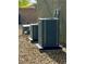Exterior shot of two air conditioning units on a gravel surface, next to a block wall at 5941 Galway Bay St, North Las Vegas, NV 89081