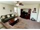 Spacious living room with a ceiling fan, comfortable furnishings, and a large entertainment center at 5941 Galway Bay St, North Las Vegas, NV 89081