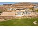 This aerial image showcases modern hillside homes with private pools overlooking the community golf course at 641 Majestic Rim Dr, Henderson, NV 89012