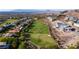 Expansive aerial view of a golf course community with luxury homes and mountain views at 641 Majestic Rim Dr, Henderson, NV 89012