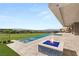 Luxury backyard featuring a fire pit, infinity pool, golf course and gorgeous mountain views at 641 Majestic Rim Dr, Henderson, NV 89012
