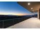 A modern balcony overlooking a golf course community with city skyline in the background at 641 Majestic Rim Dr, Henderson, NV 89012