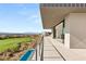 Tiled balcony with an infinity pool overlooking a golf course, desert landscape, and mountain views at 641 Majestic Rim Dr, Henderson, NV 89012