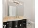 Stylish bathroom with unique vanity, ornate mirror, and modern toilet at 641 Majestic Rim Dr, Henderson, NV 89012