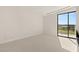 Bright bedroom featuring plush carpeting and large windows with scenic views at 641 Majestic Rim Dr, Henderson, NV 89012