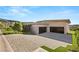 Long driveway leading to a modern home with spacious three-car garage at 641 Majestic Rim Dr, Henderson, NV 89012