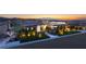 Stunning contemporary home featuring professional landscaping and city views at 641 Majestic Rim Dr, Henderson, NV 89012