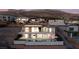 Contemporary two-story home with pool, fire pit, and mountain views at 641 Majestic Rim Dr, Henderson, NV 89012