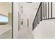 Bright hallway with staircase and large windows offers beautiful views at 641 Majestic Rim Dr, Henderson, NV 89012