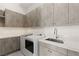 Functional laundry room with modern appliances, ample storage, and counter space at 641 Majestic Rim Dr, Henderson, NV 89012