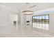 Spacious open-plan living area with high ceilings, a fireplace, and stunning views through large windows at 641 Majestic Rim Dr, Henderson, NV 89012