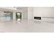 Spacious living area with a fireplace, built-in cabinetry, and sleek, minimalist design at 641 Majestic Rim Dr, Henderson, NV 89012