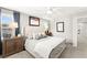Relaxing bedroom with a queen bed, two bedside tables, and a large window with blinds at 711 Florence Isle Ave, Henderson, NV 89015