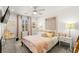 Bright bedroom featuring decor, a decorative headboard, and a large window for natural light at 711 Florence Isle Ave, Henderson, NV 89015