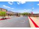 Gated community entrance with well-maintained landscaping and secure access at 711 Florence Isle Ave, Henderson, NV 89015