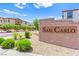 Attractive community entrance sign: San Carlo, with manicured landscaping and stone wall at 711 Florence Isle Ave, Henderson, NV 89015