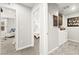 Hallway leading to laundry room and other bedrooms at 711 Florence Isle Ave, Henderson, NV 89015