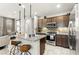 Stylish kitchen with granite countertops, stainless steel appliances, and a mosaic backsplash at 711 Florence Isle Ave, Henderson, NV 89015