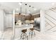 Modern kitchen with granite countertops, stainless steel appliances, and a kitchen island at 711 Florence Isle Ave, Henderson, NV 89015